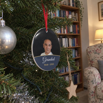 Slate personalised memorial photo bauble hanging on a Christmas tree