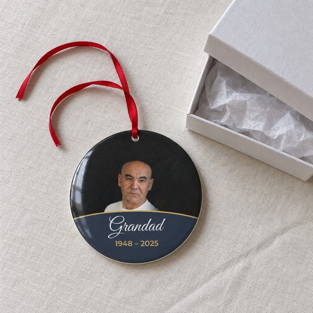 Slate personalised memorial photo bauble on a tablecloth beside a white gift box