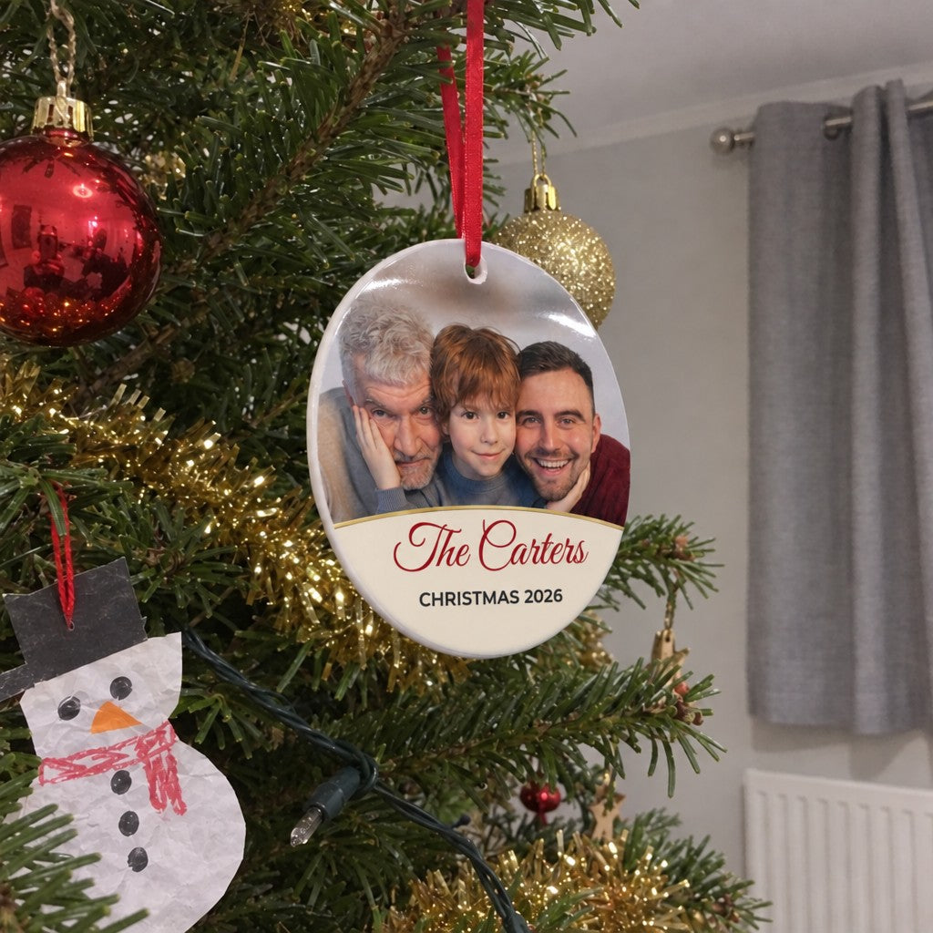Cream personalised family photo bauble hanging on a Christmas tree