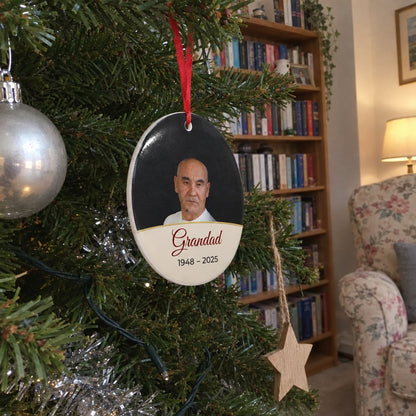 Cream personalised memorial photo bauble hanging on a Christmas tree