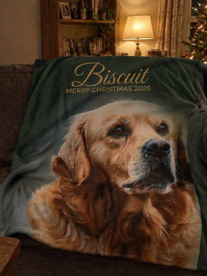 Personalised photo blanket in forest green on a sofa
