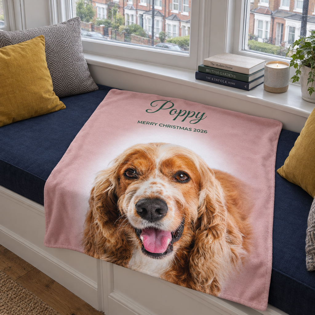 Dusty pink personalised photo blanket with a spaniel photo on a window seat