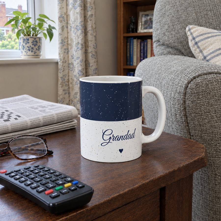 Midnight blue personalised name mug reading Grandad on a living room side table